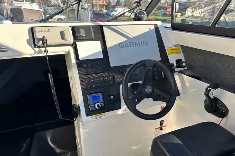 Slide: The Image of Interior view of 2026 Sealegs 8.5m Cabin boat with Garmin navigation system. - 11