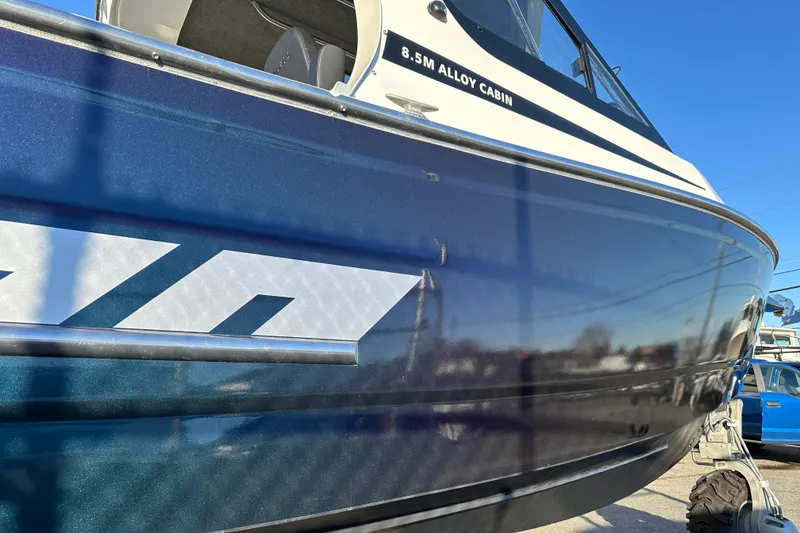 Slide: The Image of 2026 Sealegs 8.5m Cabin boat with sleek blue exterior and alloy cabin design. - 2