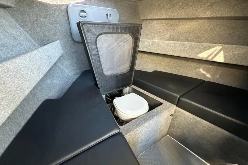 Slide: The Image of Interior of 2026 Sealegs 8.5m Cabin with compact toilet and seating. - 21
