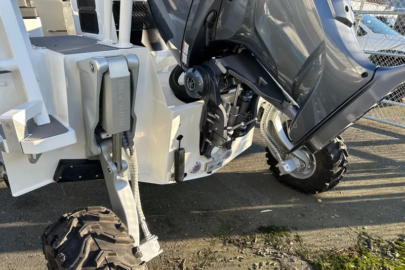 Slide: The Image of 2026 Sealegs 8.5m Cabin boat with amphibious wheels and motor, parked on concrete. - 22