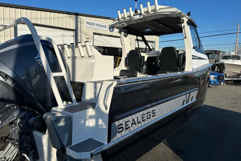 Slide: The Image of 2026 Sealegs 8.5m Cabin boat with Yamaha engine, docked outdoors. - 6