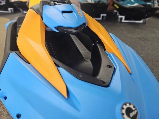 Slide: The Image of 2026 Sea-Doo Spark Trixx for 3 in blue and orange. - 10