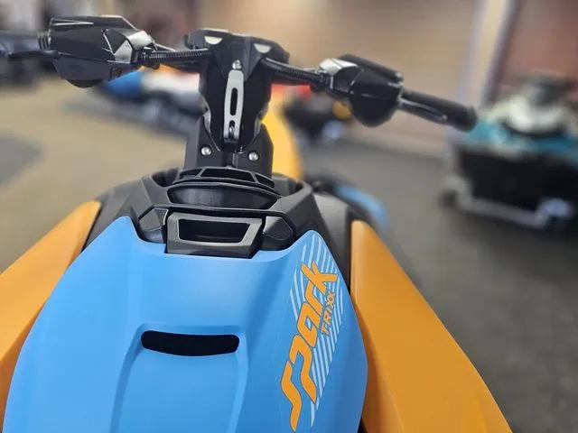 Slide: The Image of Close-up of 2026 Sea-Doo Spark Trixx jet ski, blue and orange. - 11