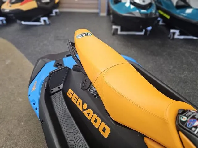 Slide: The Image of 2026 Sea-Doo Spark Trixx for 3, yellow seat, in showroom. - 12