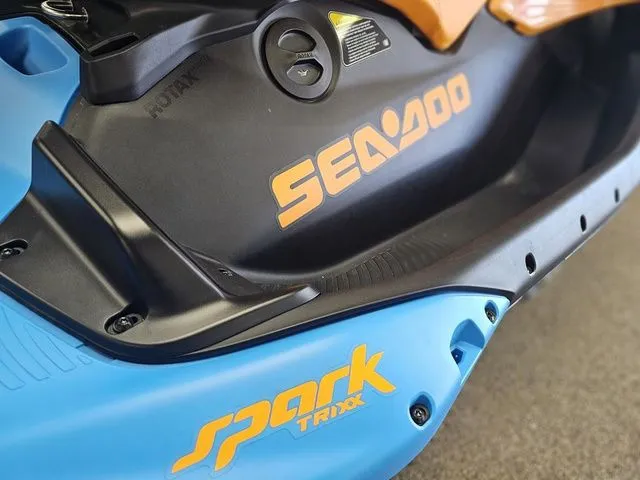 Slide: The Image of Close-up of Sea-Doo Spark Trixx 2026 jet ski in blue and orange. - 13