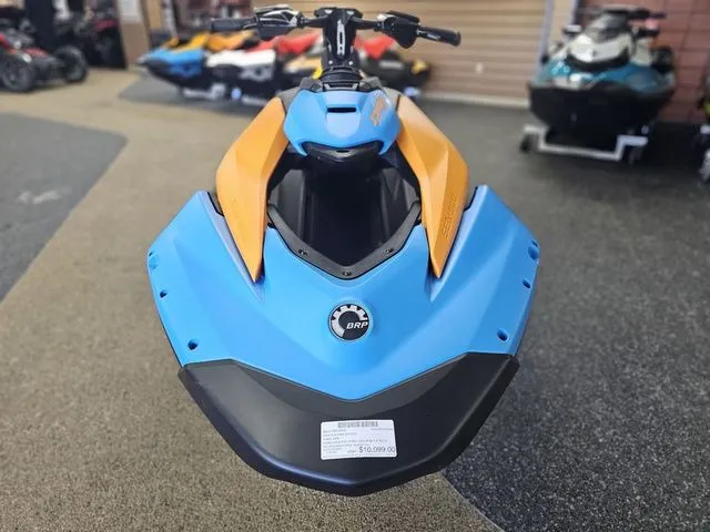 Slide: The Image of 2026 Sea-Doo Spark Trixx for 3, blue and orange, front view. - 3