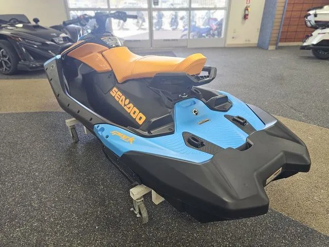 Slide: The Image of 2026 Sea-Doo Spark Trixx jet ski in showroom. - 6