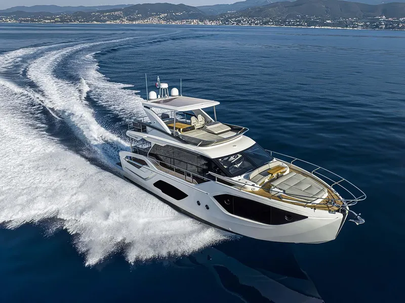 The Image of Luxurious 2026 Absolute 52 FLY yacht cruising on open water, showcasing sleek design and elegance. - 0