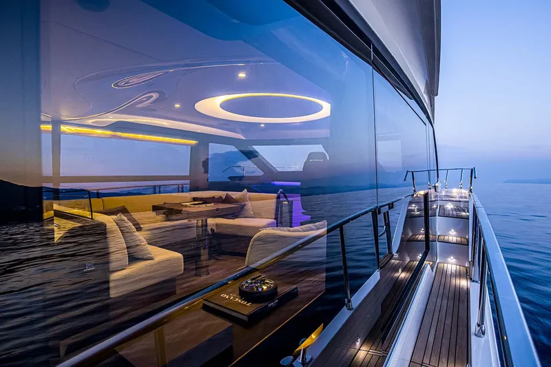 Slide: The Image of Luxury Absolute 52 FLY yacht, 2026 model, with elegant interior and ocean view at sunset. - 32