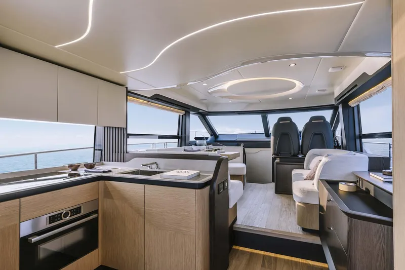 Slide: The Image of Luxurious interior of 2026 Absolute 52 FLY yacht with modern kitchen and seating area. - 35