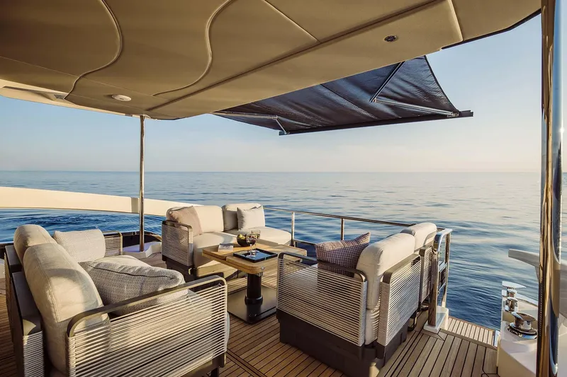Slide: The Image of Luxurious Absolute 52 FLY yacht deck with elegant seating, ocean view, 2026 model. - 27