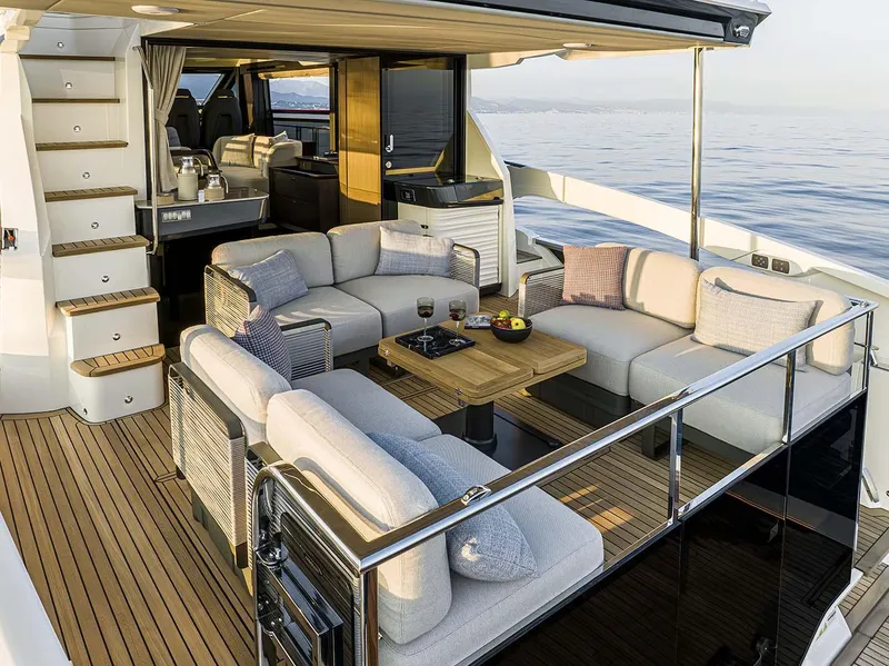 Slide: The Image of Luxurious 2026 Absolute 52 FLY yacht with elegant outdoor seating and ocean view. - 28