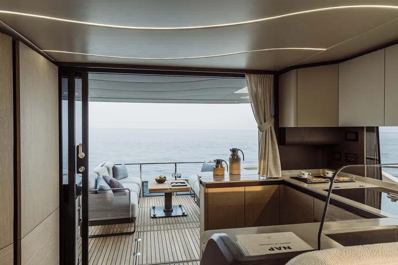 Slide: The Image of Luxurious interior of 2026 Absolute 52 FLY yacht with ocean view. - 34