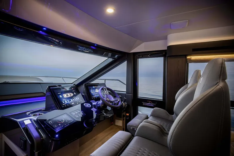 Slide: The Image of Luxurious interior of 2026 Absolute 52 FLY yacht cockpit with modern controls and ocean view. - 37