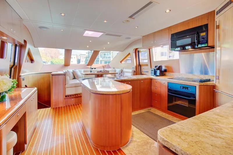 Slide: The Image of Luxurious kitchen interior of 2008 Horizon 82 Cockpit Motoryacht with modern appliances and wood finishes. - 12