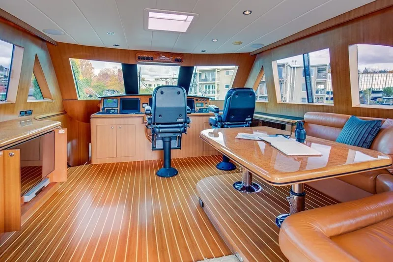 Slide: The Image of Luxurious interior of 2008 Horizon 82 Cockpit Motoryacht with wood finishes and modern helm. - 16
