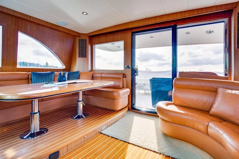 Slide: The Image of Luxurious interior of 2008 Horizon 82 Cockpit Motoryacht with leather seating and wooden accents. - 18