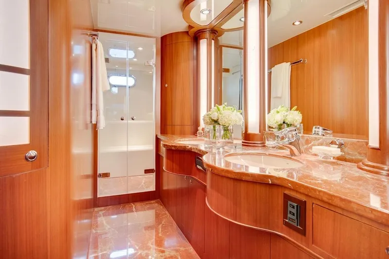 Slide: The Image of Luxurious bathroom in 2008 Horizon 82 Cockpit Motoryacht with elegant wood and marble finishes. - 23