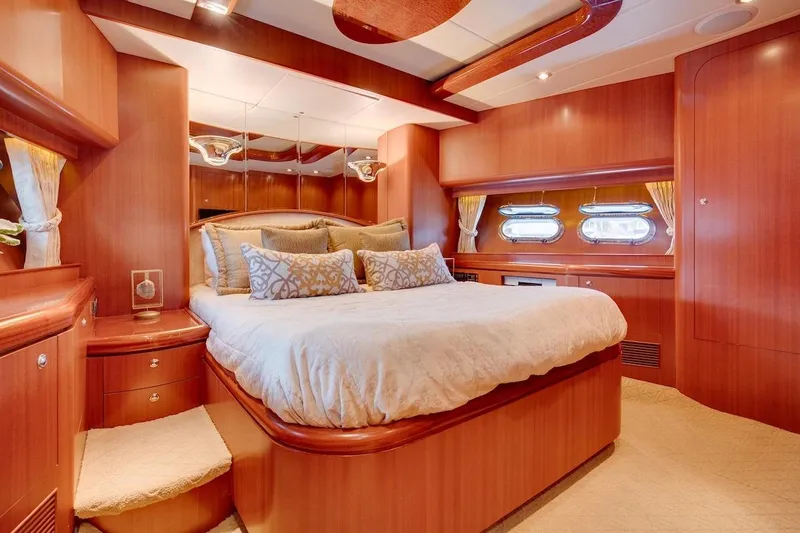 Slide: The Image of Luxurious bedroom interior of 2008 Horizon 82 Cockpit Motoryacht with elegant wood finish. - 24