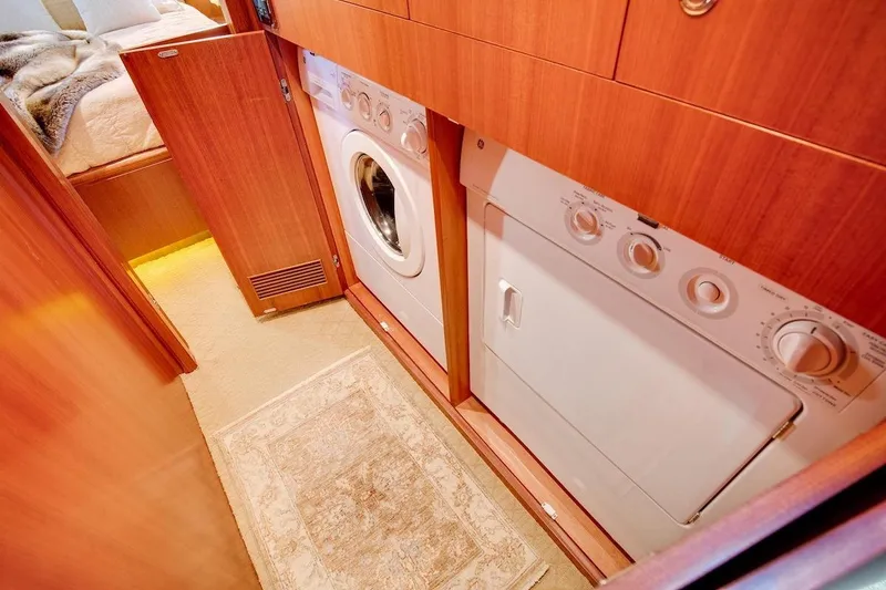 Slide: The Image of Laundry area in 2008 Horizon 82 Cockpit Motoryacht with washer and dryer. - 29