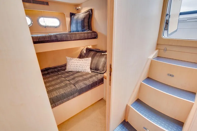 Slide: The Image of Interior of 2008 Horizon 82 Cockpit Motoryacht with cozy bunk beds and stairs. - 30