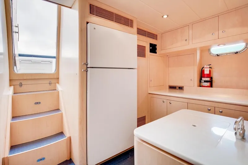 Slide: The Image of Interior of 2008 Horizon 82 Cockpit Motoryacht with modern kitchen and stairs. - 32