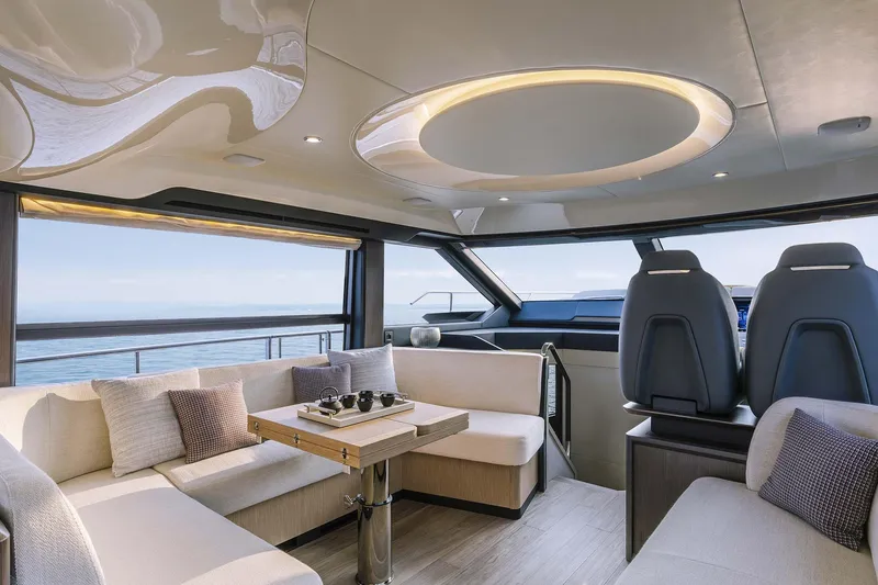 Slide: The Image of Luxurious interior of 2026 Absolute 52 FLY yacht with modern seating and ocean view. - 17