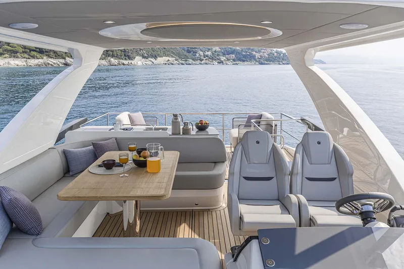 Slide: The Image of Luxurious 2026 Absolute 52 FLY yacht interior with dining area and ocean view. - 5