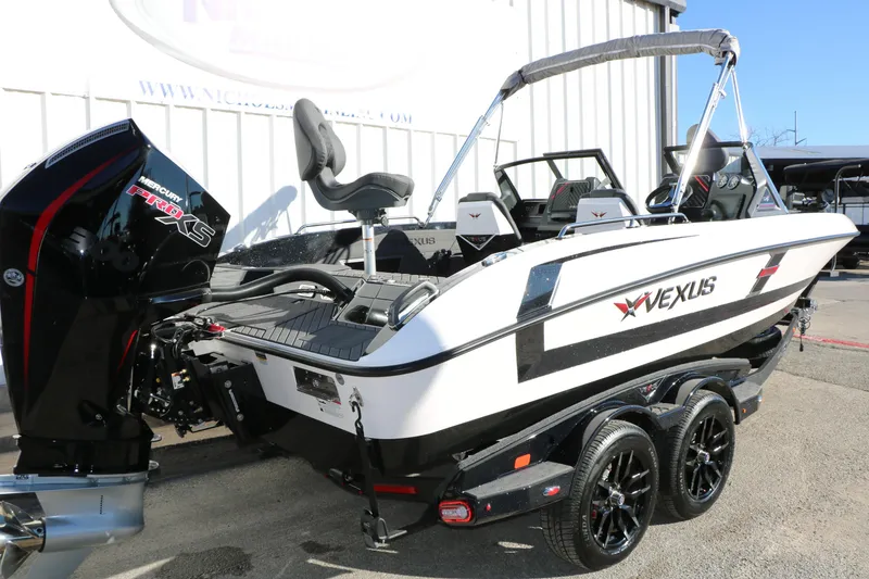 Slide: The Image of 2025 Vexus DVX 20S boat with Mercury Pro XS engine, parked on a trailer. - 1