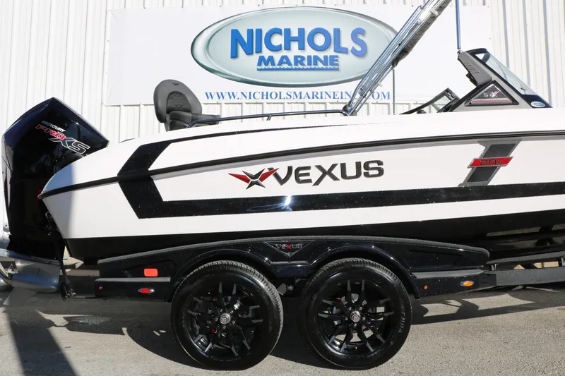 Slide: The Image of 2025 Vexus DVX 20S boat at Nichols Marine dealership, featuring sleek design and modern features. - 11