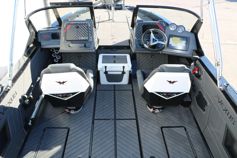 Slide: The Image of 2025 Vexus DVX 20S boat interior with dual consoles and modern dashboard. - 14