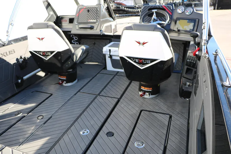 Slide: The Image of 2025 Vexus DVX 20S boat interior with modern seating and navigation controls. - 17