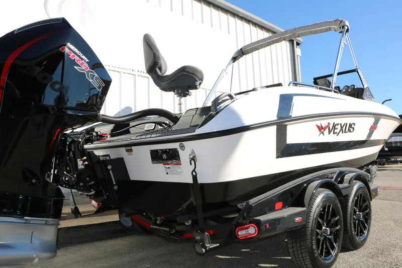 Slide: The Image of 2025 Vexus DVX 20S boat with Mercury Pro XS engine, parked on a trailer. - 2