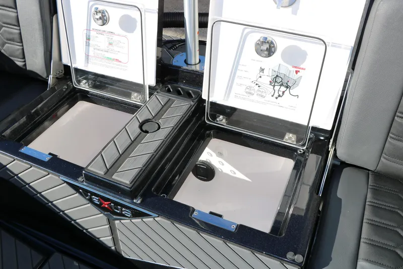Slide: The Image of 2025 Vexus DVX 20S boat interior with open storage compartments and instructional labels. - 29
