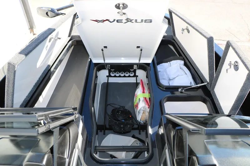 Slide: The Image of 2025 Vexus DVX 20S boat interior with open storage compartments and equipment. - 32