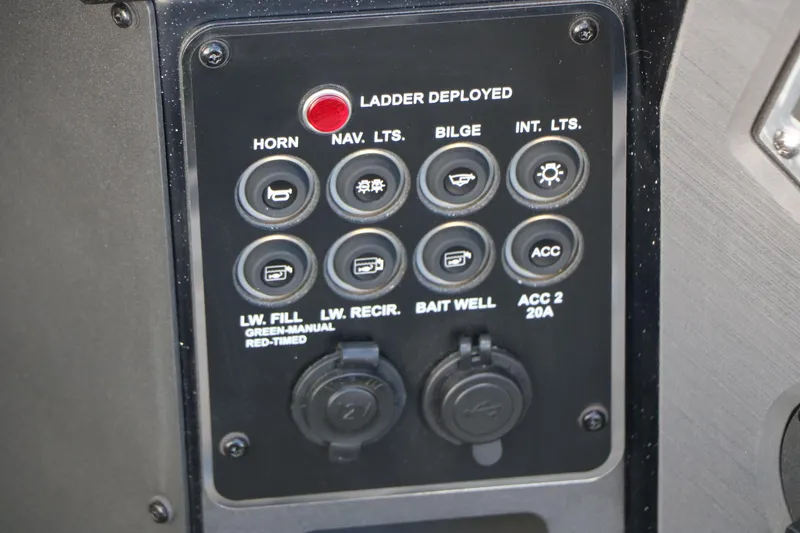 Slide: The Image of Control panel of 2025 Vexus DVX 20S boat with various switches and indicators. - 34
