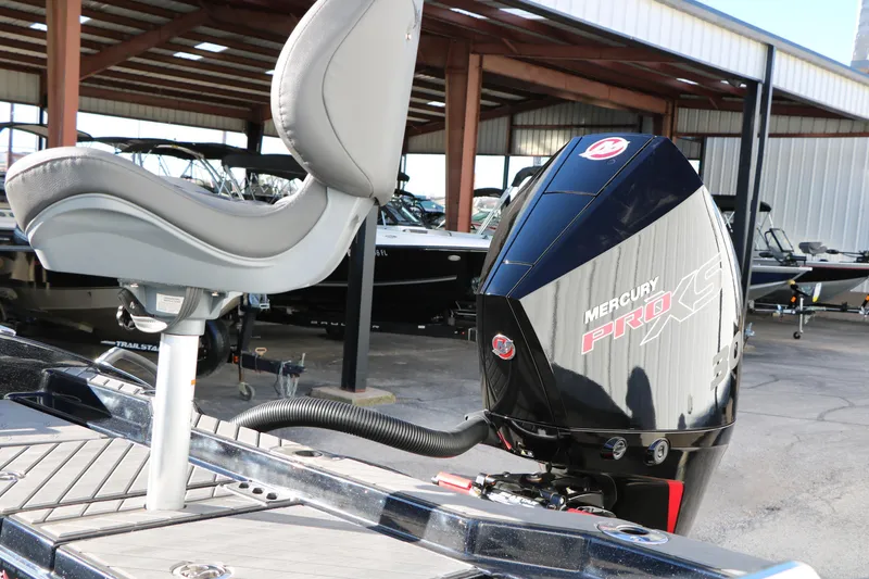 Slide: The Image of 2025 Vexus DVX 20S boat with Mercury Pro XS engine in a marina setting. - 7