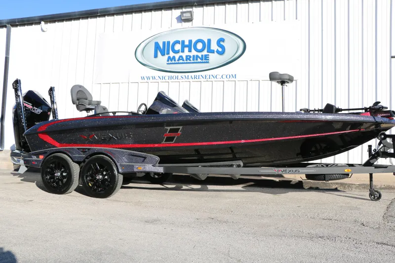 The Image of 2026 Vexus VXs21 boat at Nichols Marine dealership, featuring sleek black and red design. - 0