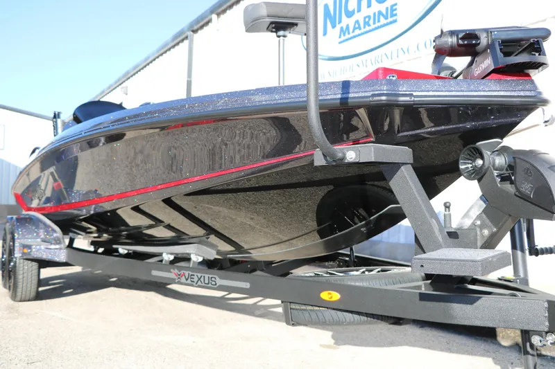 Slide: The Image of 2026 Vexus VXs21 boat on trailer, sleek design with red accents, displayed outdoors. - 13