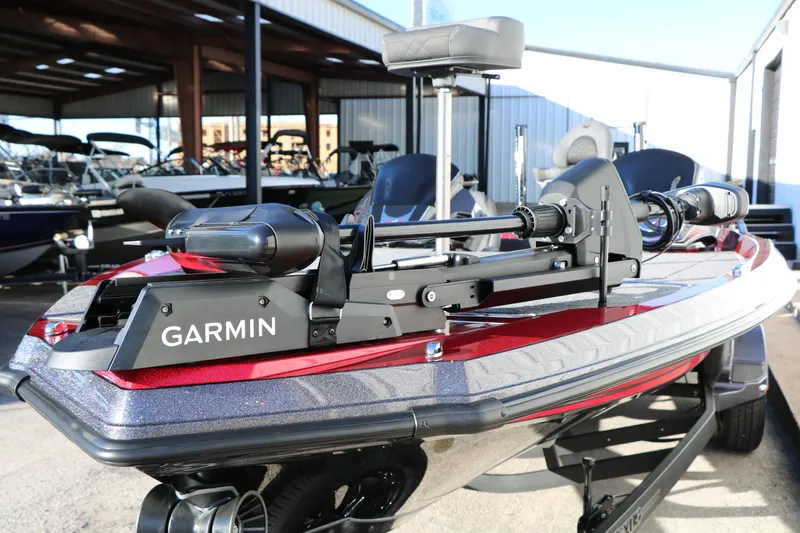 Slide: The Image of 2026 Vexus VXs21 boat with Garmin equipment, parked in a marina setting. - 14