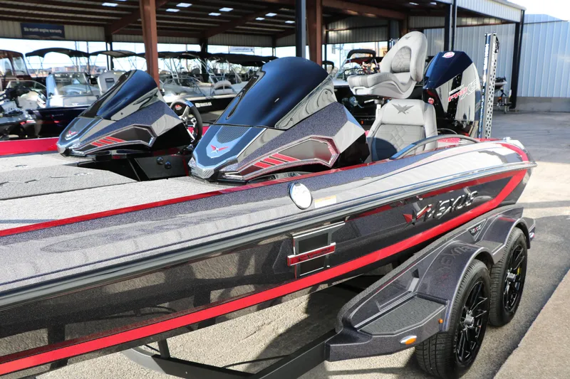 Slide: The Image of 2026 Vexus VXs21 boat with sleek design and modern features in a showroom. - 16