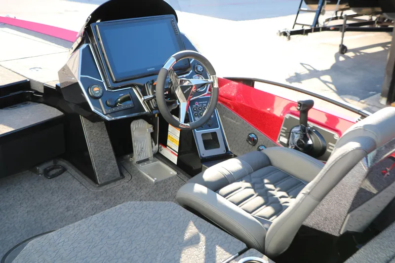 Slide: The Image of 2026 Vexus VXs21 boat cockpit with steering wheel, control panel, and comfortable seating. - 21