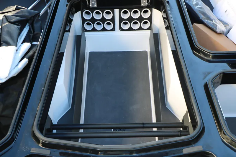 Slide: The Image of Interior storage compartment of 2026 Vexus VXs21 boat with rod holders. - 25