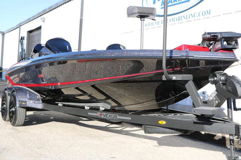 Slide: The Image of 2026 Vexus VXs21 boat on trailer, sleek design with red accents. - 3