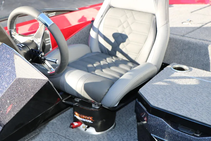 Slide: The Image of 2026 Vexus VXs21 boat interior with gray captain's seat and steering wheel. - 34