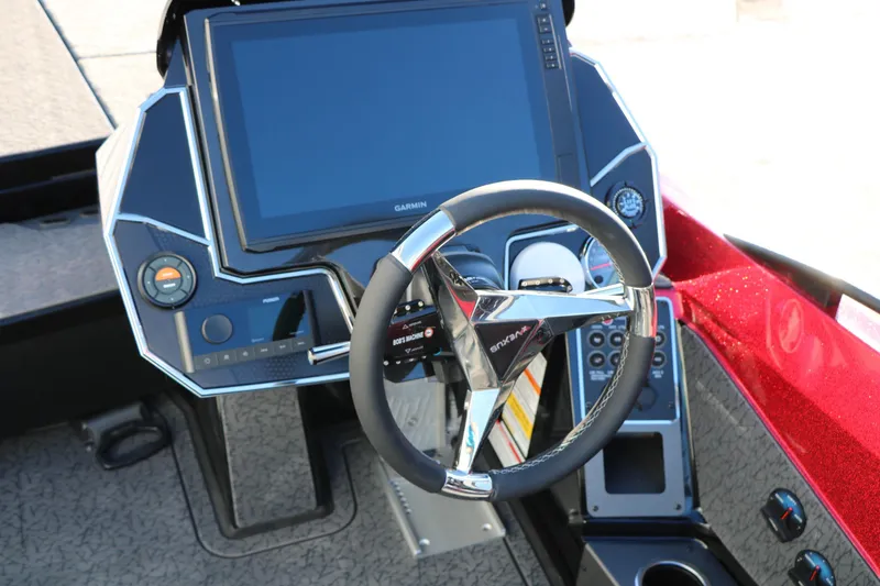 Slide: The Image of 2026 Vexus VXs21 boat dashboard with steering wheel and Garmin display. - 38