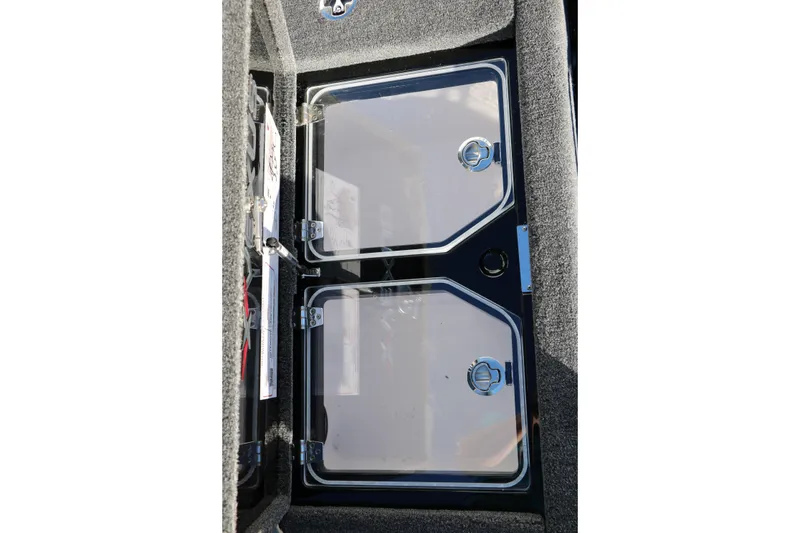 Slide: The Image of 2026 Vexus VXs21 boat storage compartments with clear lids and secure latches. - 42