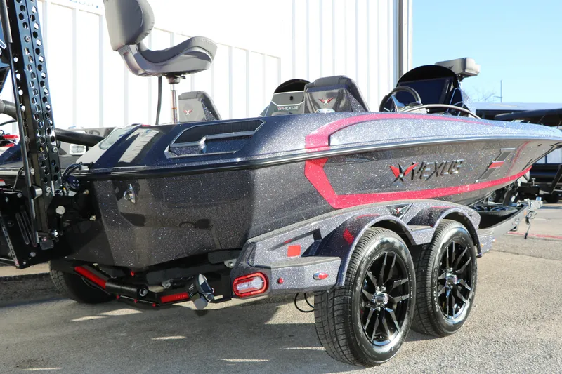 Slide: The Image of 2026 Vexus VXs21 boat with sleek design and dual-axle trailer. - 5