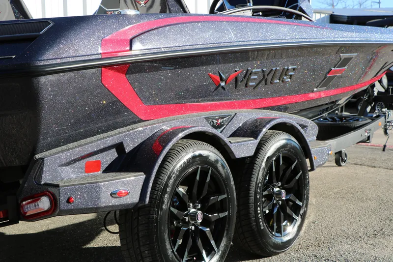 Slide: The Image of 2026 Vexus VXs21 boat with glittery finish and sleek design on a trailer. - 6