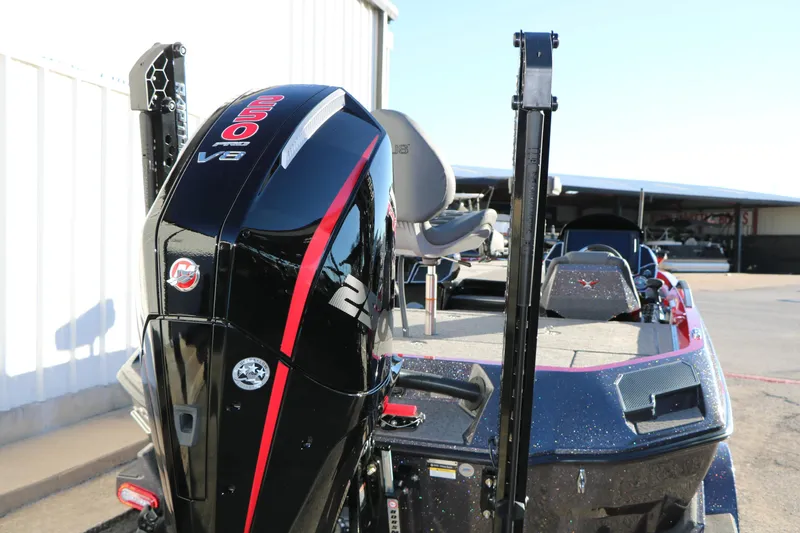 Slide: The Image of 2026 Vexus VXs21 boat with powerful 250 Pro V8 engine, docked outdoors. - 7